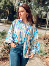 picture one woman wearing Alright Tonight Lantern Top with denim jeans