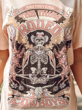 picture 1 of woman wearing and they call the thing rodeo tee with skeleton 