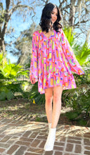 Jump back in time to the grooviest decade with this one-of-a-kind Abstract Dress! Featuring a multicolor print with a retro-inspired look, this babydoll mini dress will give you those good vibes! Be the envy of all your friends when you show up in this piece of fashion history. So, don't be shy - show off your bold style! Picture 1 woman in Groovy Babe Abstract Dress | Multi Color