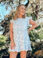picture 1 woman in Fallon Textured Babydoll Dress | Blue